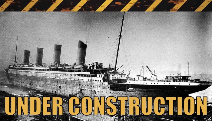 "Under Construction" warning stripes with a photo of RMS Titanic under construction